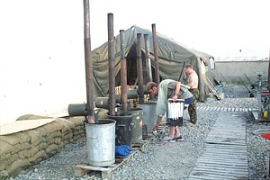 Back to basics. The British peace-keepers have to collect their washing water from these tanks