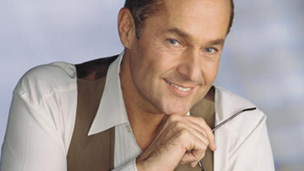 A man leaning his chin on his hand