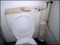 The top of a toilet cistern is missing