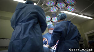 A surgeon and operating team