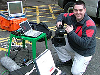 Kevin Bird with satellite transmission equipment