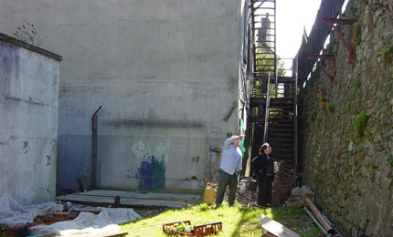 Part of the yard is flanked by the historic city walls.