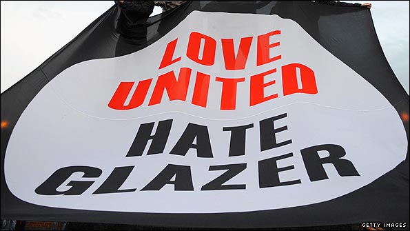 Manchester United fans with a banner protesting against the Glazers