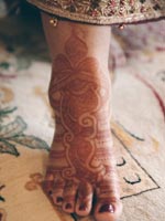 Bride's feet decorated with henna