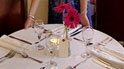 Candle and flowers on restaurant table
