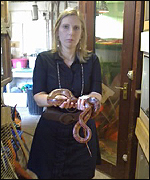 jo holds snakes