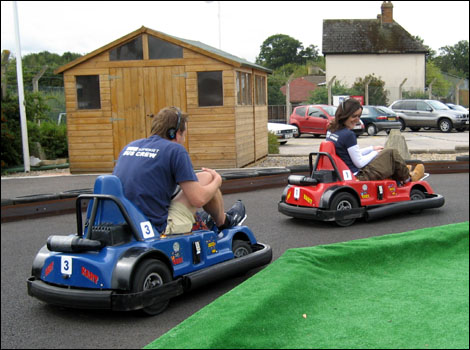 Jo Phillips and Andrew Enever racing in go carts