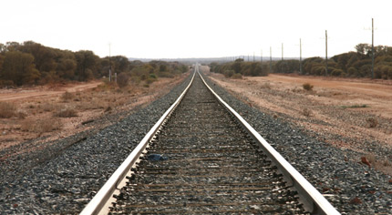 A lonely straight railroad.