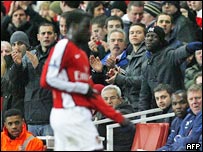 Arsenal's Emmanuel Eboue leaving the pitch 