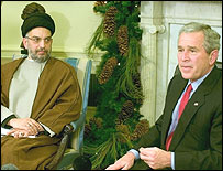 George Bush ve Abdülaziz el Hekim 