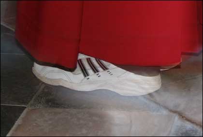 Cassock and a pair of trainers