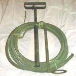 Stirrup Hand-pump with dual jet and spray nozzle. Used to extinguish the Magnesium {Electron) bomb (incendiary bomb). 30 feet of hose could be used by fire-guards at a safe distance from heat and fire. A jet of water could be fired from 30 feet or as a spray at 15 feet. Stirrup Hand-pump with dual jet and spray nozzle. Used to extinguish the Magnesium {Electron) bomb (incendiary bomb). 30 feet of hose could be used by fire-guards at a safe distance from heat and fire. A jet of water could be fired from 30 feet or as a spray at 15 feet.