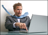 A scared businessman sending an email