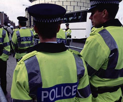 Policemen in yellow jackets