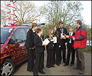 Students being interviewed with mobile studio 