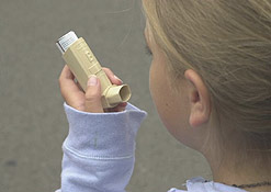 A child uses an inhalor
