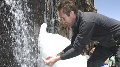 Bruce drinks the glacial water from the source
