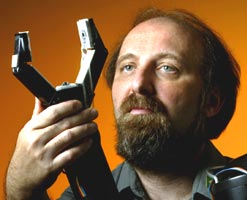 Prof. Miguel Nicolelis with a robotic arm