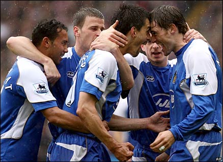Wigan players celebrate Paul Scharner's (centre) goal against Sheffield United
