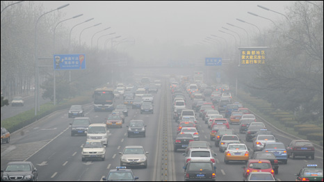 Vehicular traffic crowds the Second Ring Road amid a hazy smog engulfing Beijing