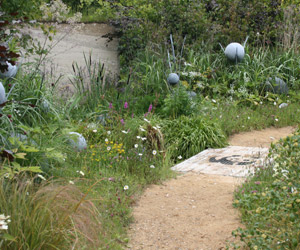 A rammed earth wall representing the chalk aquifers that filter rainwater