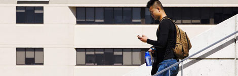 A man walking and texting at the same time