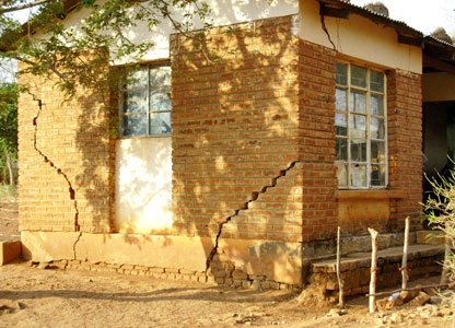 cracks in a mudbrick staffroom