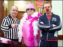 Three people dressed for Red Nose Day