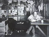 Photo of Scott in his den at Cape Evans