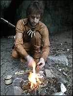 Reconstruction of prehistoric man lighting a fire