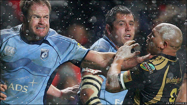 Ospreys scrum half Ricky Januarie (right) and Xavier Rush of the Blues clash