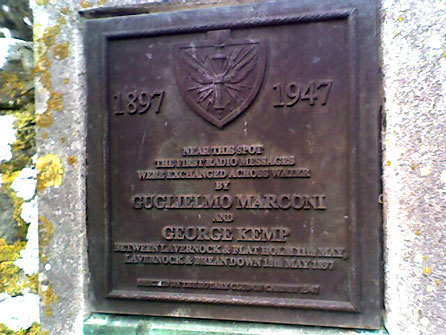 Plaque commemorating the achievements of Guglielmo Marconi and George Kemp, St Lawrence churchyard, Lavernock
