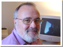 Photograph of Cliff Lockyer at his computer.