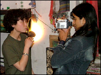 Roots coordinator Parminder and an artist