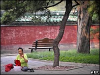 Lady knitting in Ritan park, Beijing