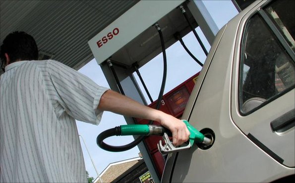 Man fills car at petrol station