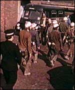 Rescue workers going towards pit