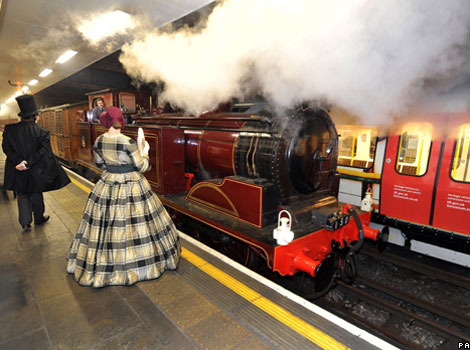 A steam train pulls into Moorgate station