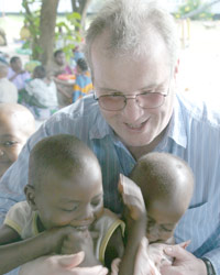 Richard Moore with children in Tanzania