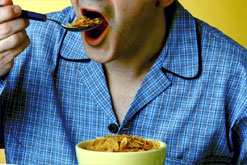 Image: a man eating breakfast