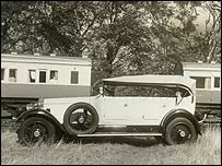A Rolls Royce and train carriages