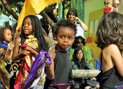 A group of children get ready to take to the stage for their year-end performance