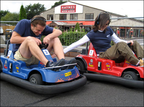 Jo Phillips and Andrew Enever racing in go carts