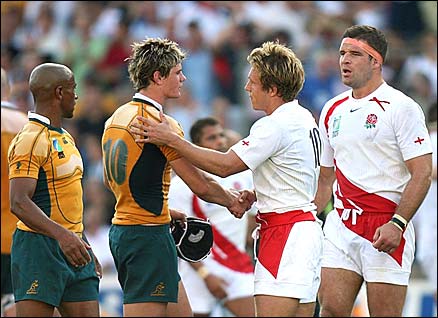 Australian and England players shake hands at the end of the match