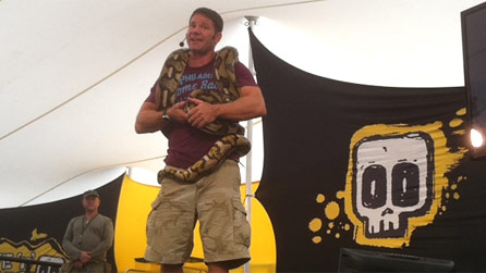 Steve Backshall with a reticulated python around his neck.