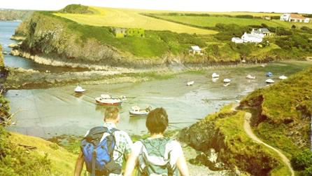 Derek and Gwenno marching down the hill towards Abercastle.