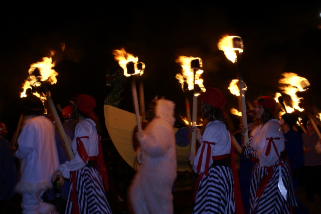 Guizers with their torches