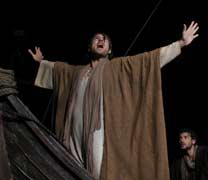 Jesus stands in the prow and shouts