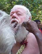 Driving a skewer through Carl's cheek into his mouth