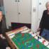 Paul and his producer Malcolm have a game of table football.